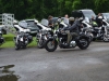 civilian-riding-motorcycle-passed-line-up-cops-min