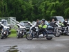 officer-in-reflective-vest-riding-motorcycle-min