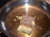 onions-in-pan-cooking-min